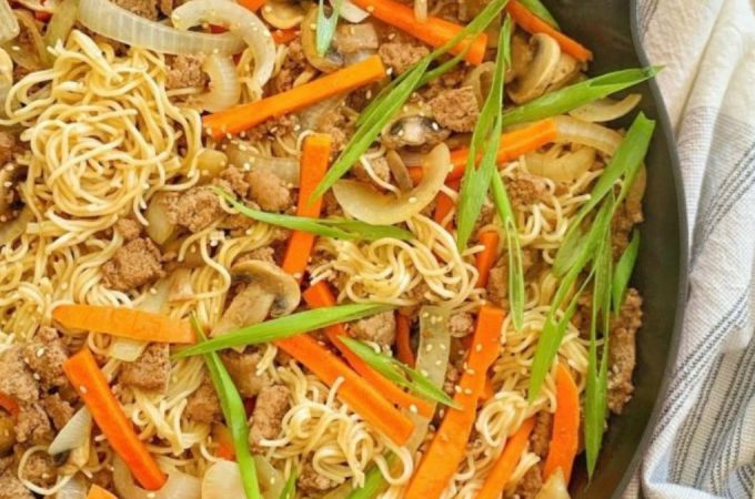 A skillet of ramen noodle stir fry.