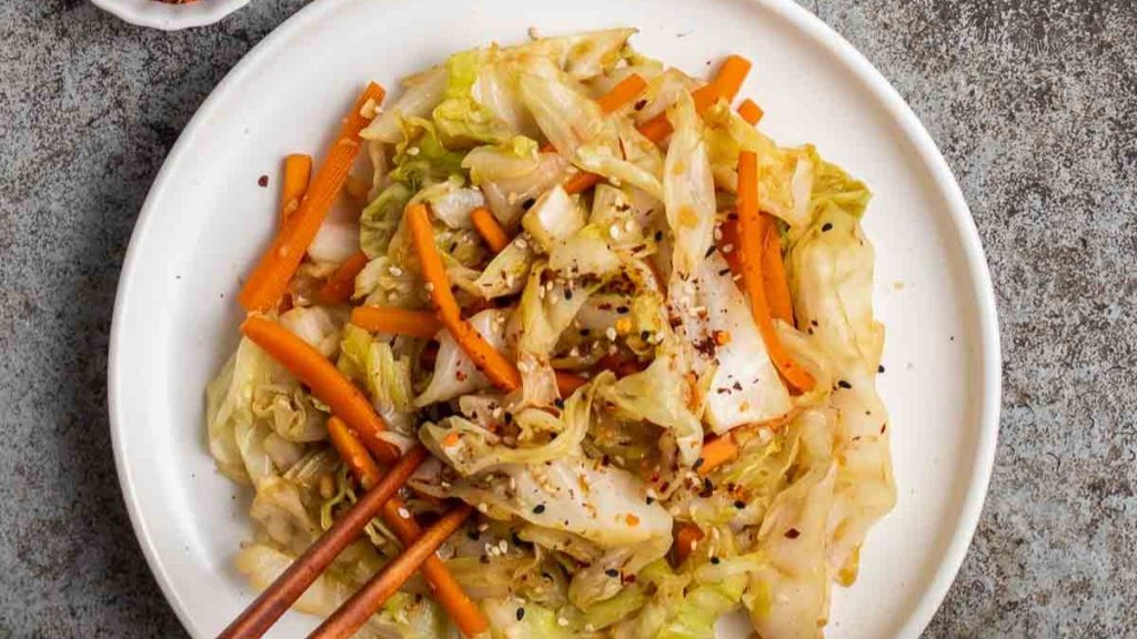 Cabbage and carrot stir fry on a plate.