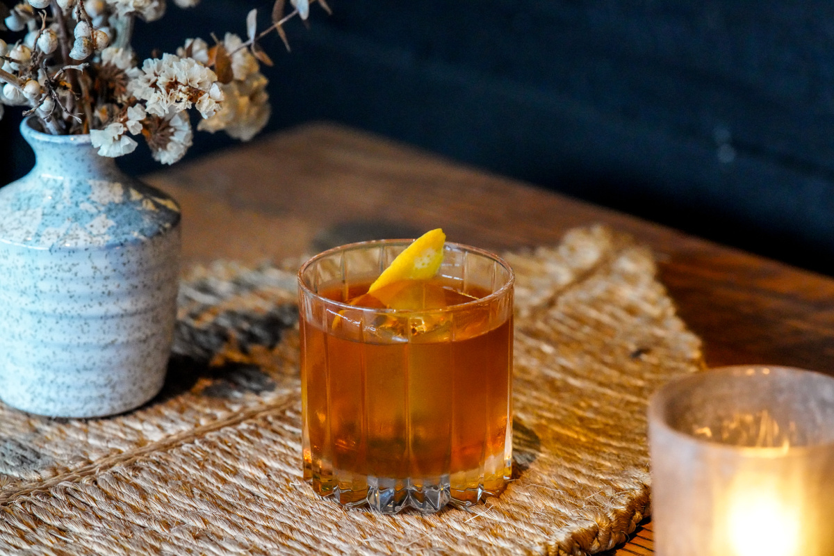Campfire Old Fashioned cocktail on a table