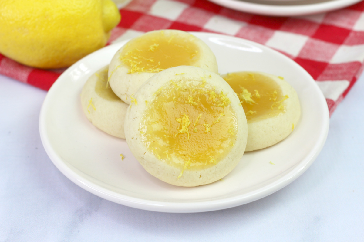a plate of lemon thumbprint cookies